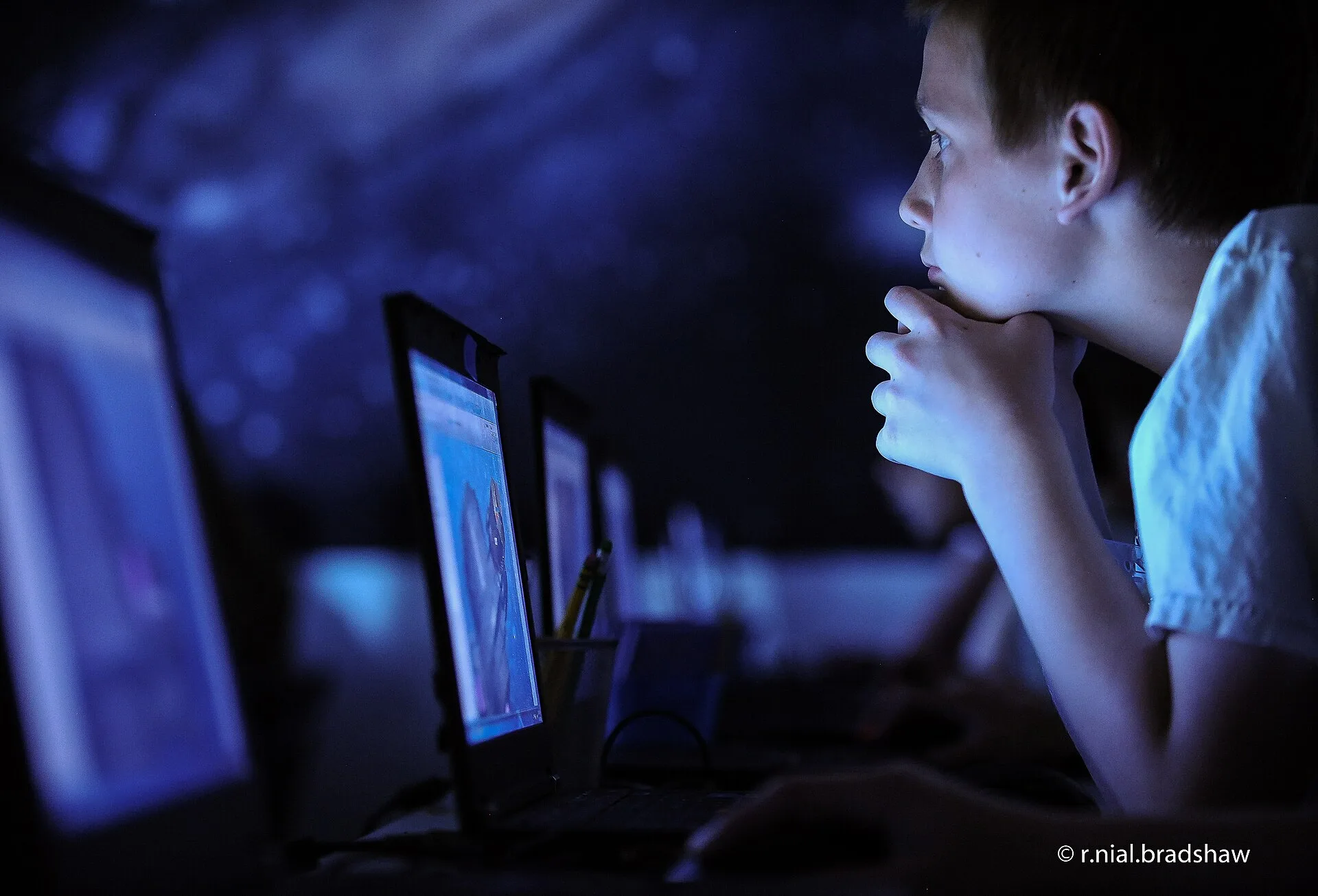 Child using computer. Deepfake nudes teen safety parents: response cost examples