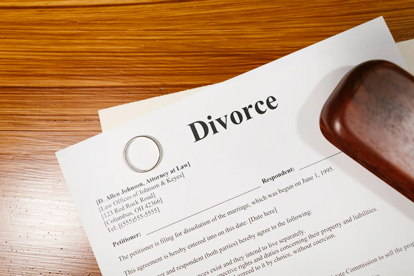 Close-up of a divorce document and wedding ring on a lawyer's desk. What happens when eight vague clauses in family agreements get rewritten?
